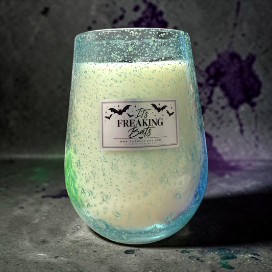 Doodlations Coffee Bar & Boutique It's Freaking Bats soy candle in a hand-blown glass vessel with glow-in-the-dark specks