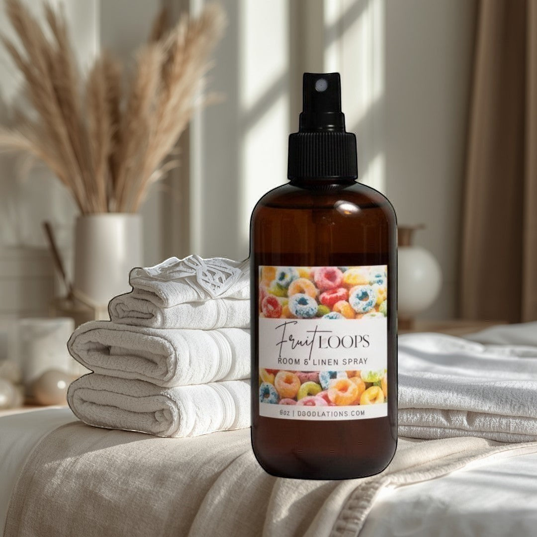 Doodlations Boutique Fruit Loops room and linen spray in amber bottle with colorful cereal graphic.