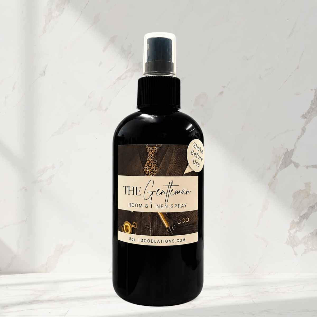 Doodlations Coffee Bar & Boutique The Gentleman room and linen spray in a black 8oz bottle with a sophisticated label.