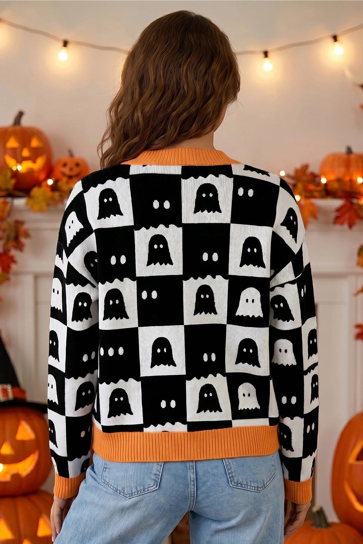 Doodlations Coffee Bar & Boutique black and white geometric ghost print knit cardigan with orange trim
