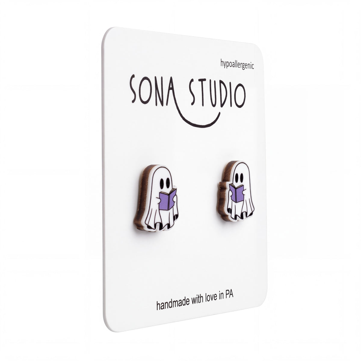 Doodlations Coffee Bar & Boutique handmade ghost earrings reading purple books on a display card