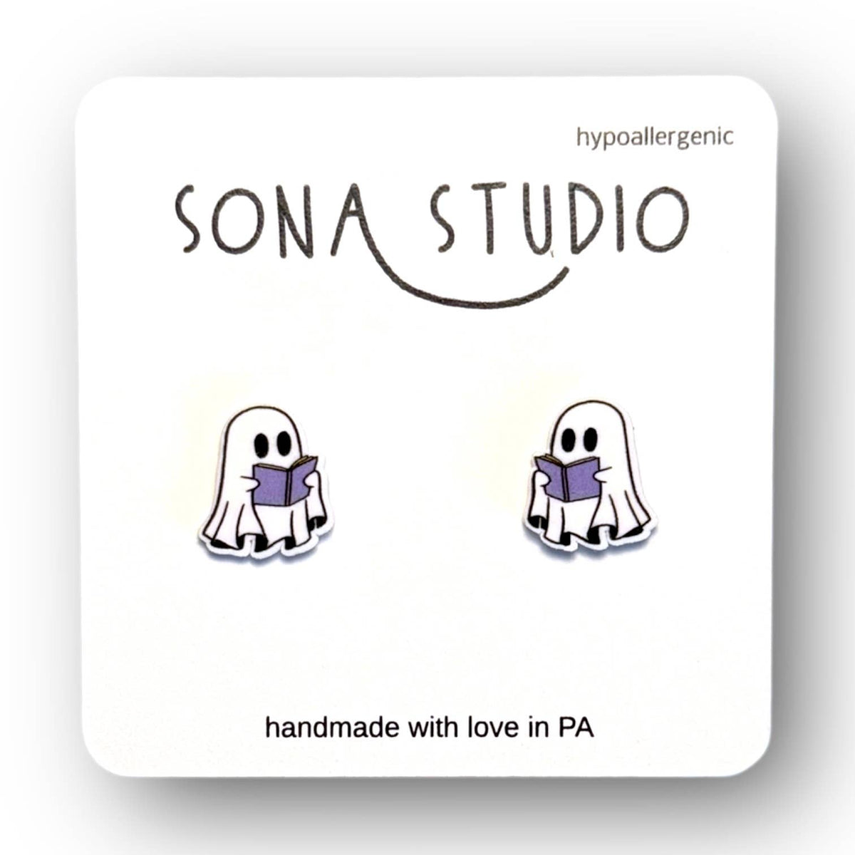 Doodlations Coffee Bar & Boutique handmade ghost earrings featuring a cute white ghost reading a purple book