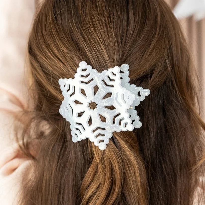 Doodlations Coffee Bar & Boutique white glitter snowflake flat hair clip worn in brown hair for a festive look