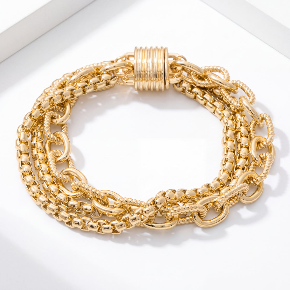 Doodlations Coffee Bar & Boutique 14K gold-plated multi-strand layered chain bracelet with a secure magnetic lock.