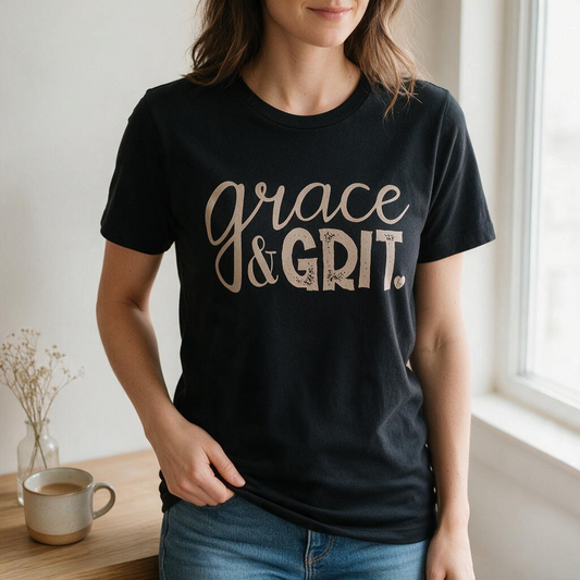 Woman wearing a black Doodlations Coffee Bar & Boutique t-shirt with Grace and Grit printed in metallic gold lettering.
