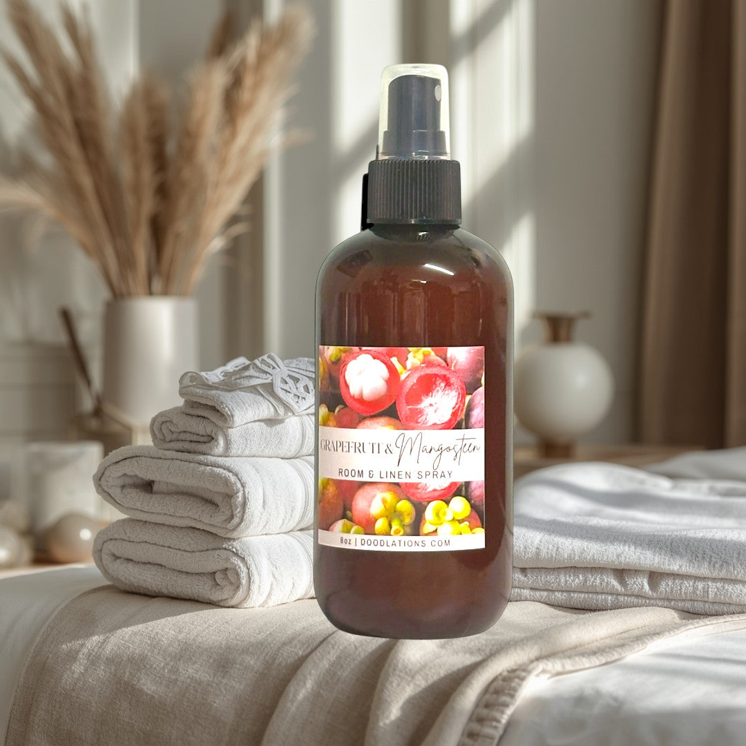 Doodlations Coffee Bar & Boutique Grapefruit Mangosteen Room & Linen Spray bottle with label showing fruit.