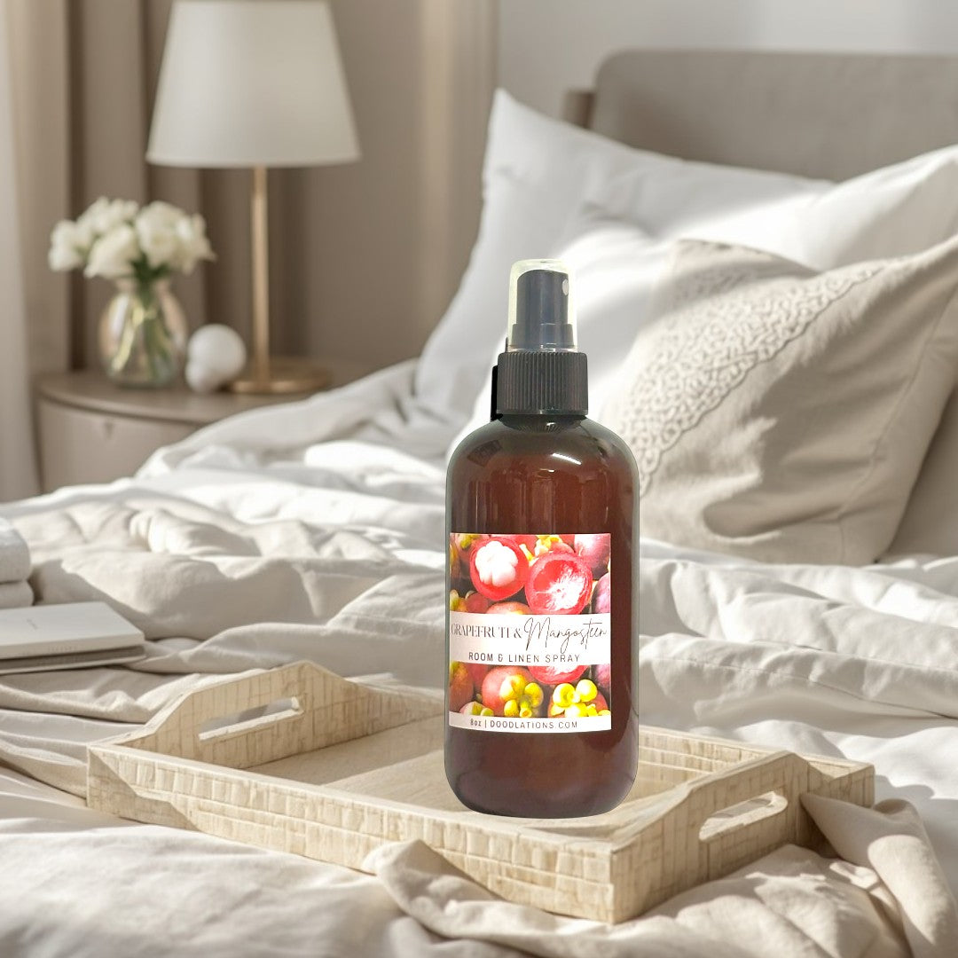 Doodlations Coffee Bar & Boutique Grapefruit Mangosteen Room & Linen Spray bottle with label showing fruit.