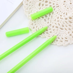 Doodlations Coffee Bar & Boutique bright green gel pens with removable caps on a white lace doily background