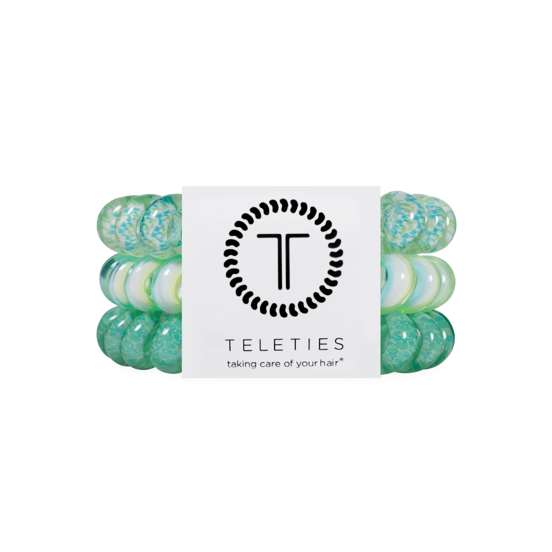Doodlations Coffee Bar & Boutique By the Sea Shore spiral hair ties in shades of green and white on display card.