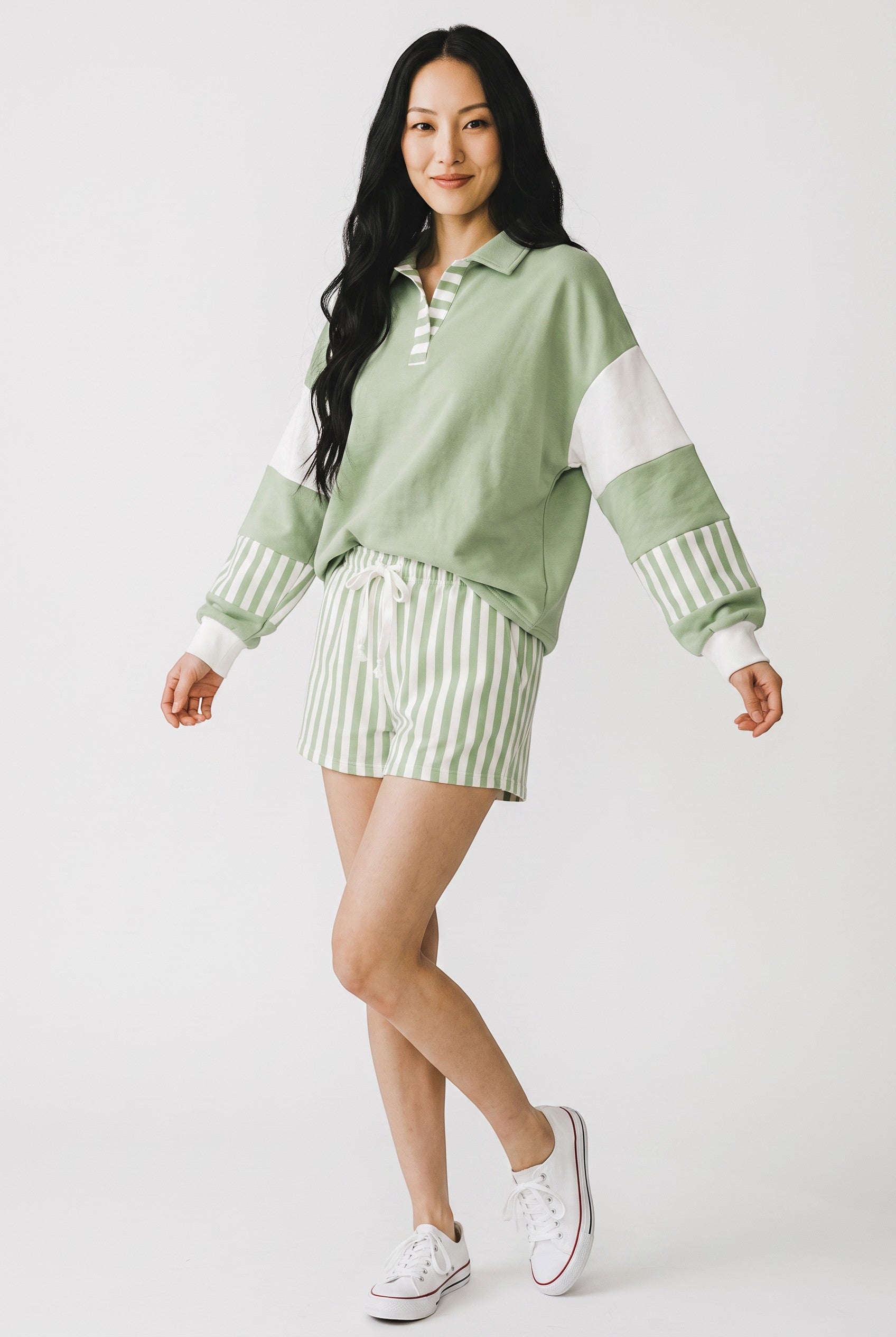 Doodlations Coffee Bar & Boutique smoke green color block pullover and striped drawstring shorts lounge set on model