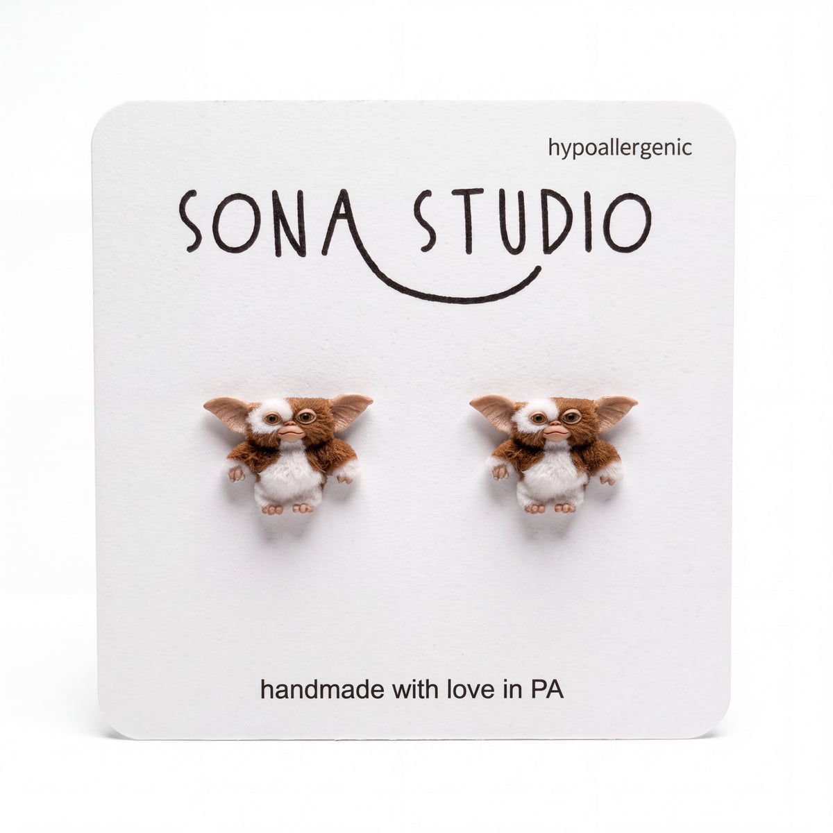 Doodlations Coffee Bar & Boutique Before Midnight handmade earrings featuring cute brown and white gremlin characters.