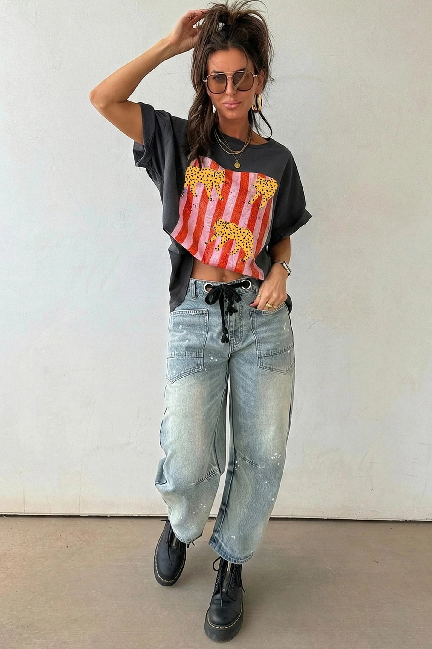 Doodlations Coffee Bar & Boutique dark grey retro graphic tee with cheetah and stripe print worn with light wash jeans