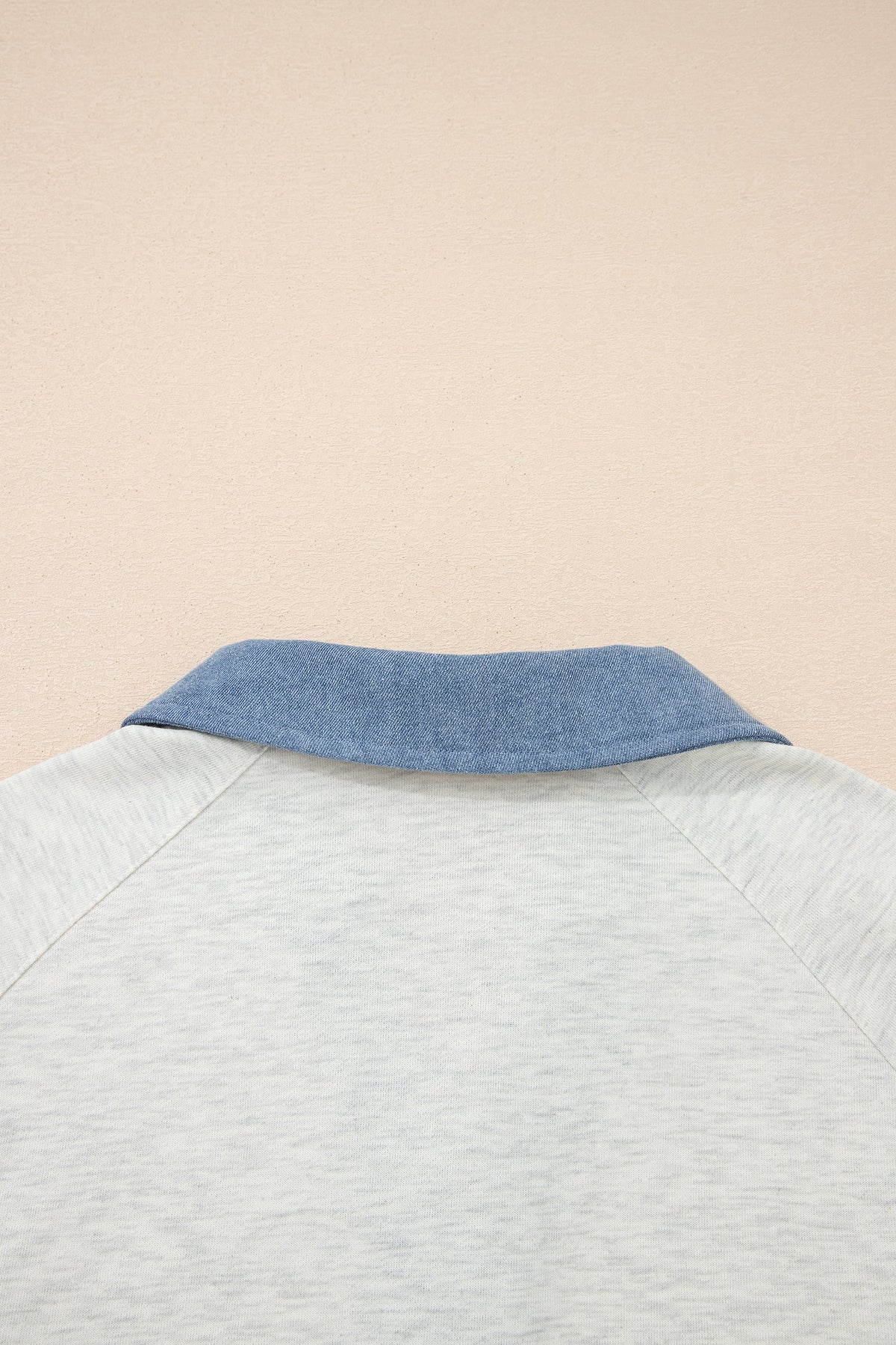Doodlations Coffee Bar & Boutique light grey denim long sleeve top with a contrasting blue denim polo collar