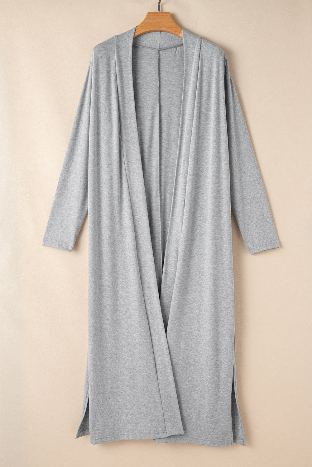 Doodlations Coffee Bar & Boutique grey longline cardigan with side slits, crafted from soft, lightweight fabric.