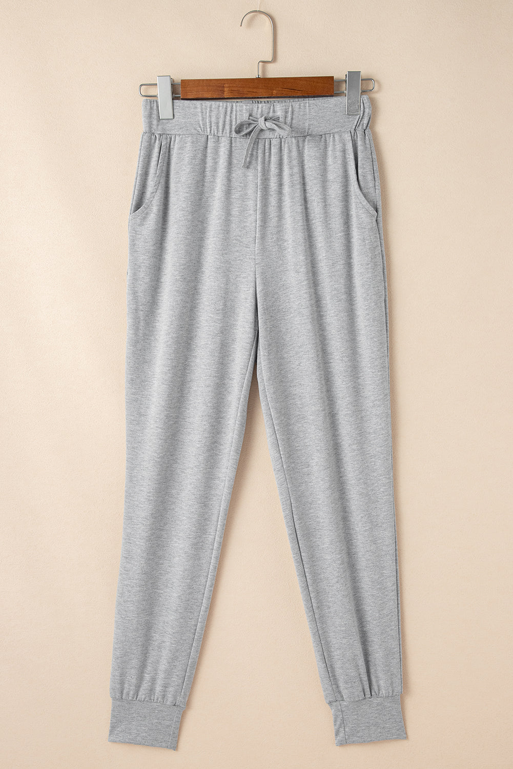 Doodlations Coffee Bar & Boutique grey lounge joggers with elastic drawstring waist, side pockets, and cuffed ankles.