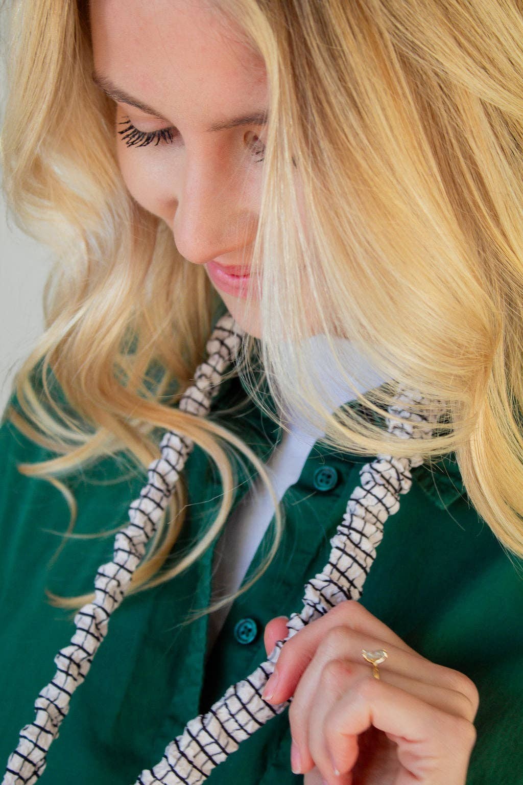 Doodlations Coffee Bar & Boutique black and white grid pattern crushed polyester lanyard worn by a blonde woman