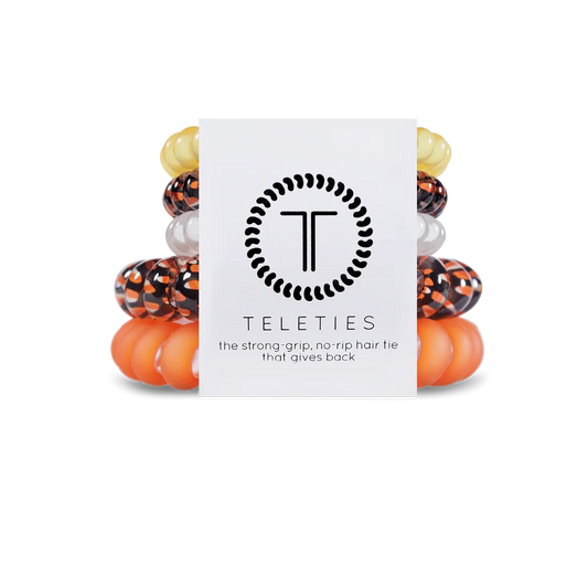 Doodlations Coffee Bar & Boutique Halloween mixed hair ties pack featuring orange, black, and white spiral coils.