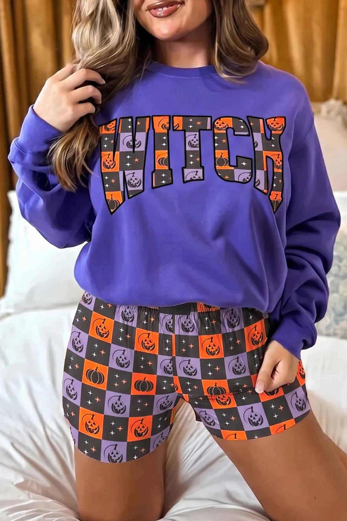 Doodlations Coffee Bar & Boutique purple long sleeve sweatshirt with Witch print and matching pumpkin checkered shorts