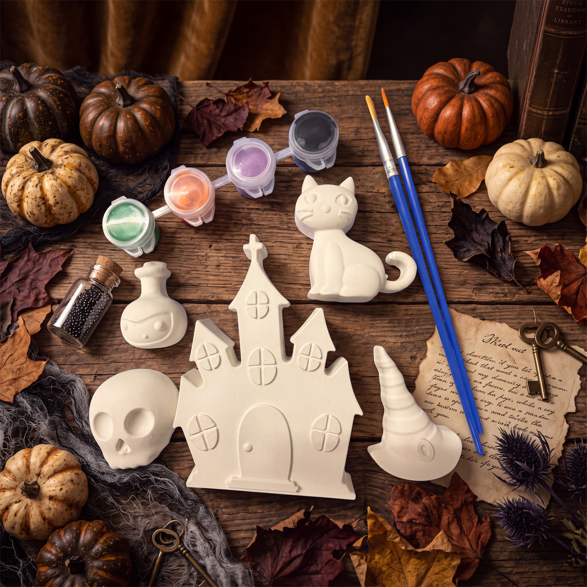 Doodlations Coffee Bar & Boutique Halloween plaster painting kit with five figurines, paints, and brushes on wood.
