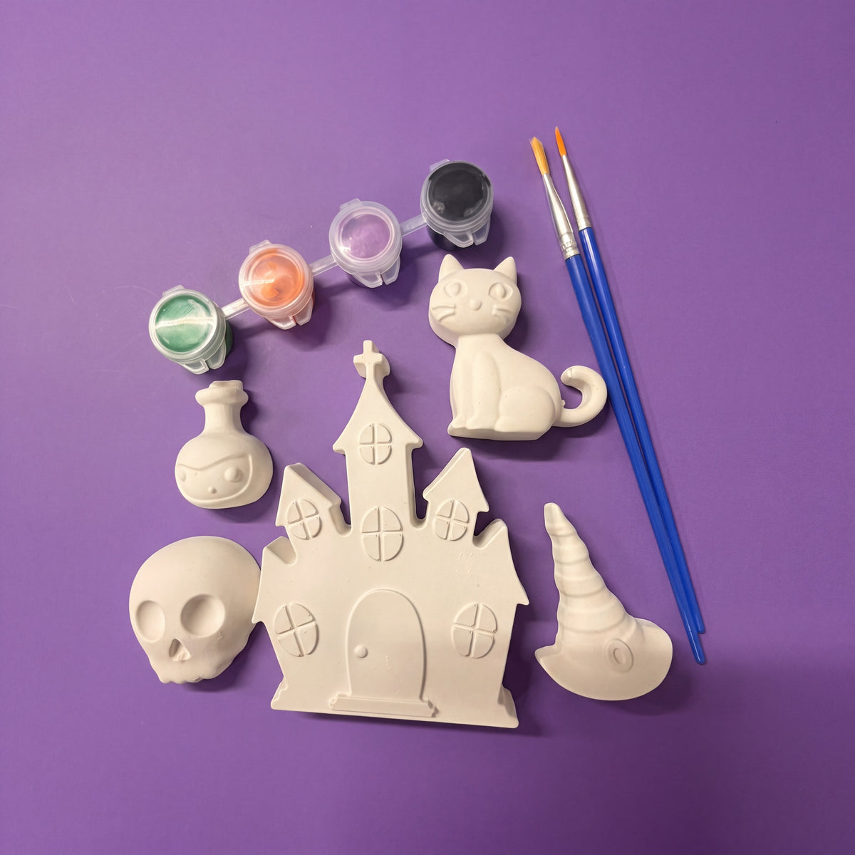 Doodlations Coffee Bar & Boutique Halloween plaster painting kit with 5 spooky figurines, paint pots, and brushes.