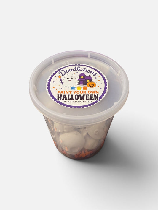 Doodlations Coffee Bar & Boutique Halloween plaster paint kit in a clear plastic container with a themed label.