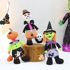 Doodlations Coffee Bar & Boutique fabric plush Halloween ornaments including a pumpkin, skeleton, and witch doll.