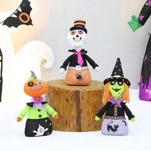 Doodlations Coffee Bar & Boutique fabric plush Halloween ornaments featuring a pumpkin, skeleton, and witch doll.