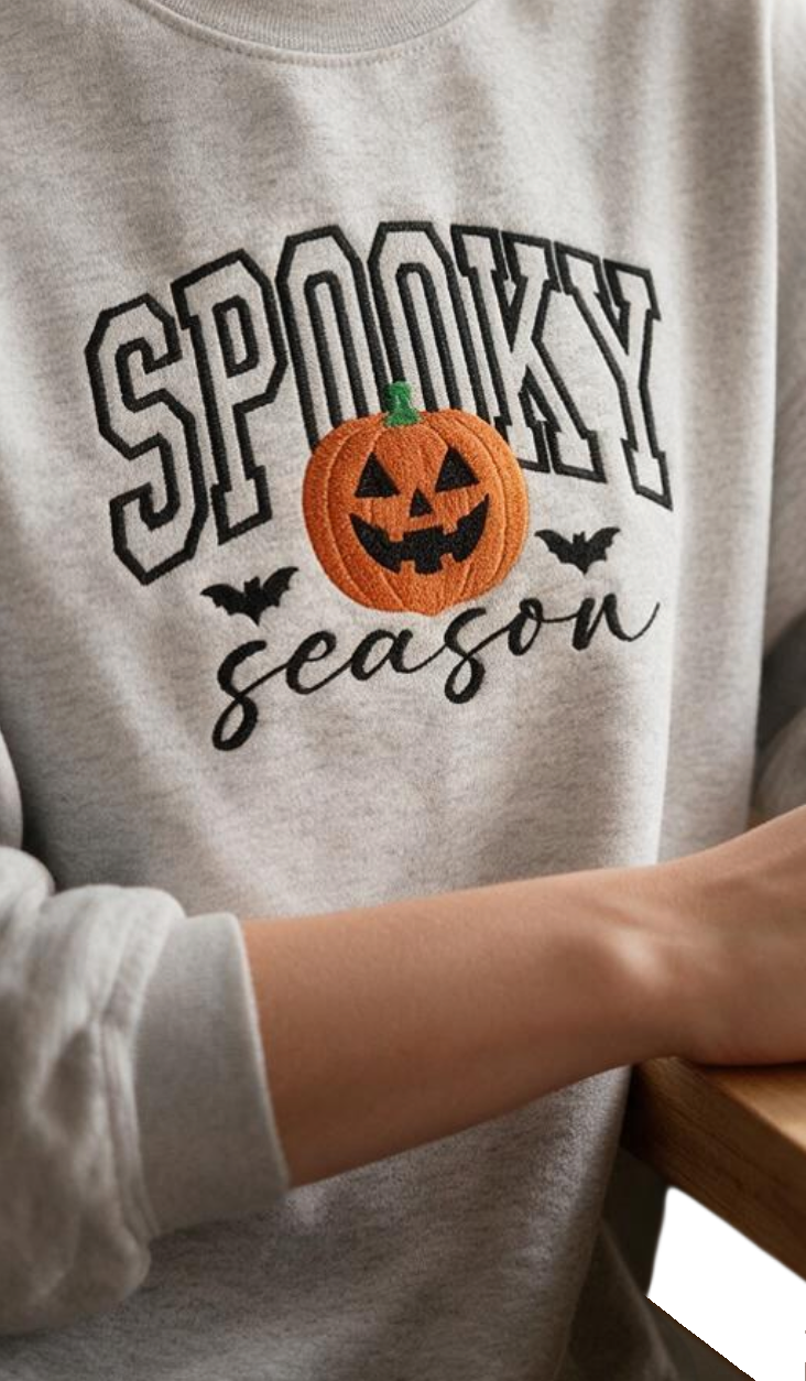 Doodlations Coffee Bar & Boutique grey unisex sweatshirt with embroidered Spooky Season pumpkin and bat design