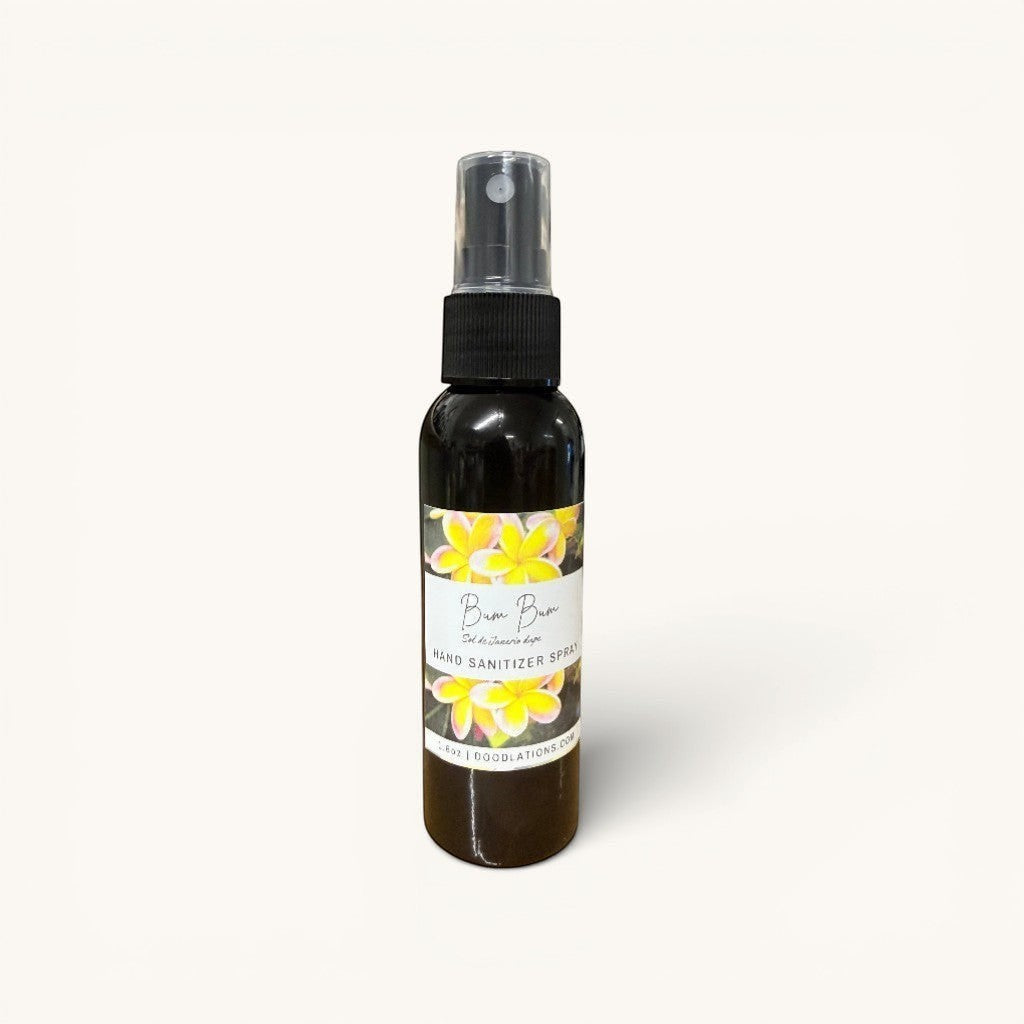 Doodlations Coffee Bar & Boutique Bum Bum hand sanitizer spray with floral label and black cap.