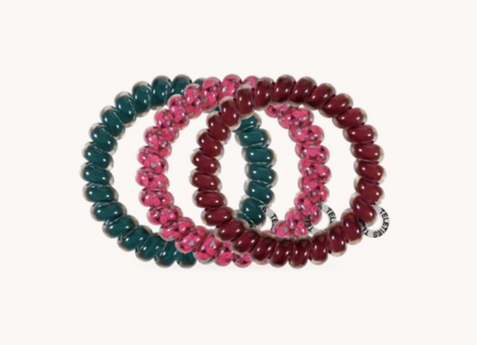 Doodlations Coffee Bar & Boutique Teleties spiral hair ties in teal, berry plaid, and burgundy jewel tones.