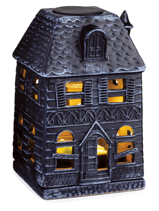 Doodlations Coffee Bar & Boutique porcelain haunted mansion fragrance warmer with glowing windows and spooky decor