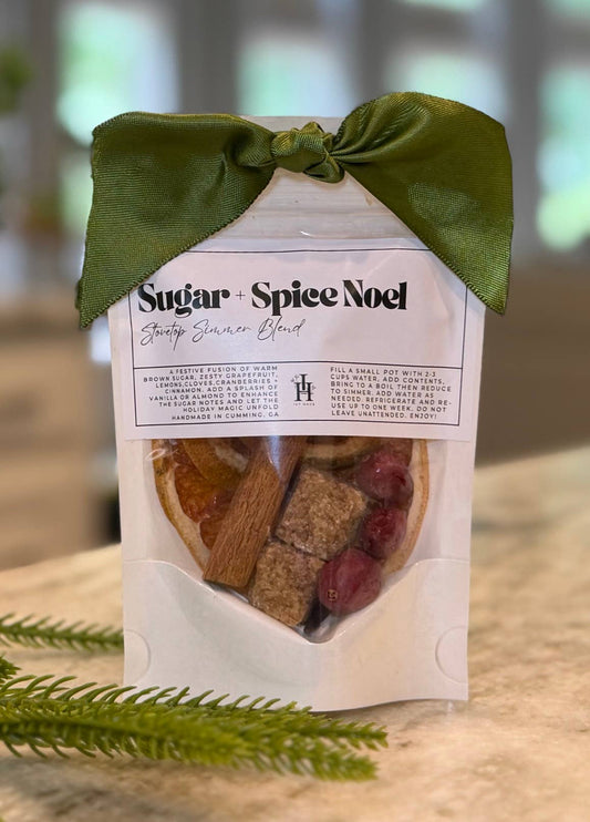 Doodlations Coffee Bar & Boutique Sugar+Spice Noel stovetop simmer blend with dried fruit, cinnamon, and green ribbon.