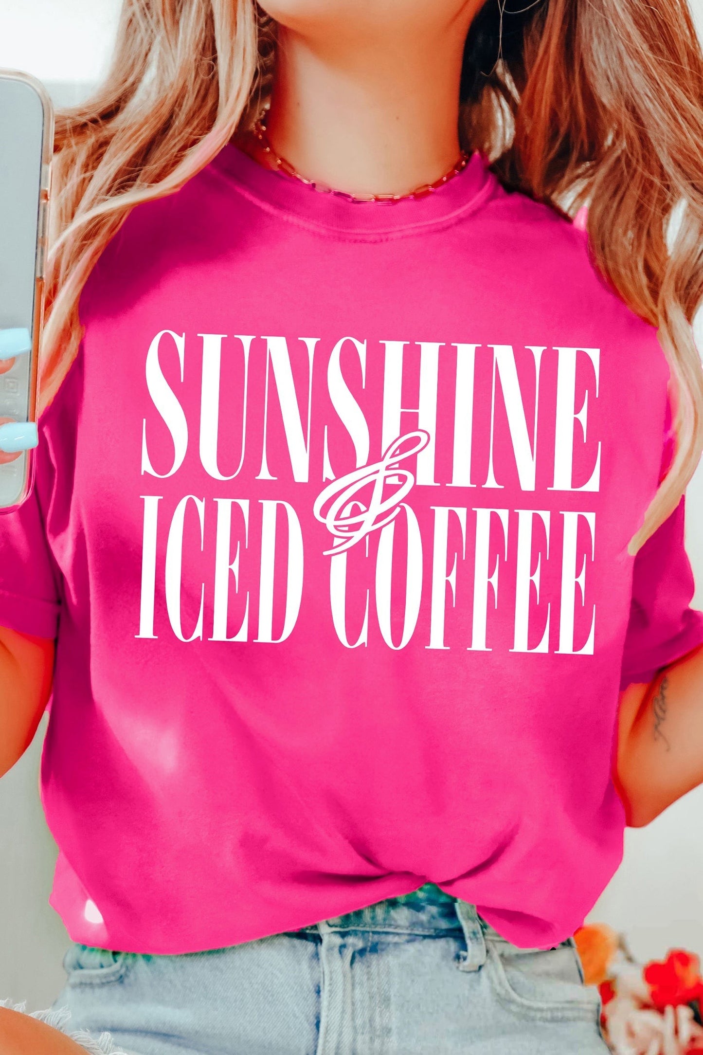 Doodlations Coffee Bar & Boutique hot pink crewneck t-shirt with white Sunshine and Iced Coffee graphic text.