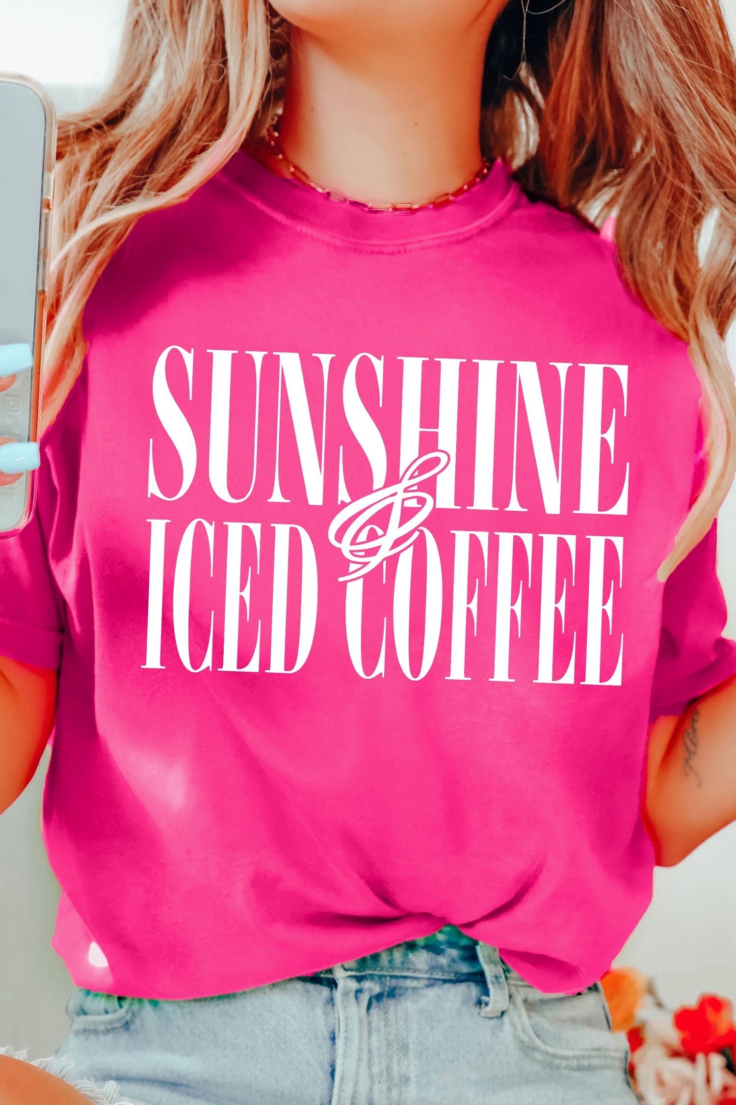 Doodlations Coffee Bar & Boutique hot pink crewneck t-shirt with white Sunshine and Iced Coffee graphic text.