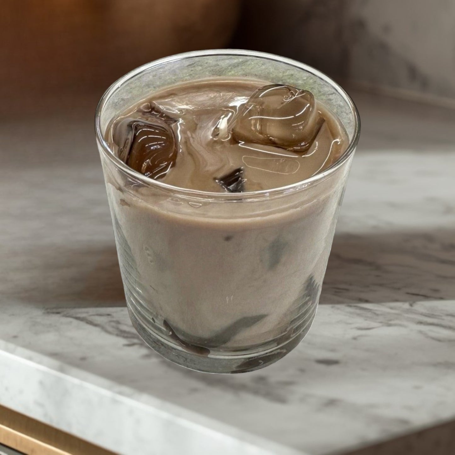 Doodlations Coffee Bar & Boutique Iced Hazelnut & Crème Coffee candle with coffee beans on a wooden surface.