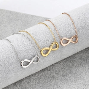 Doodlations Coffee Bar & Boutique infinity symbol pendant necklaces in silver, gold, and rose gold stainless steel.