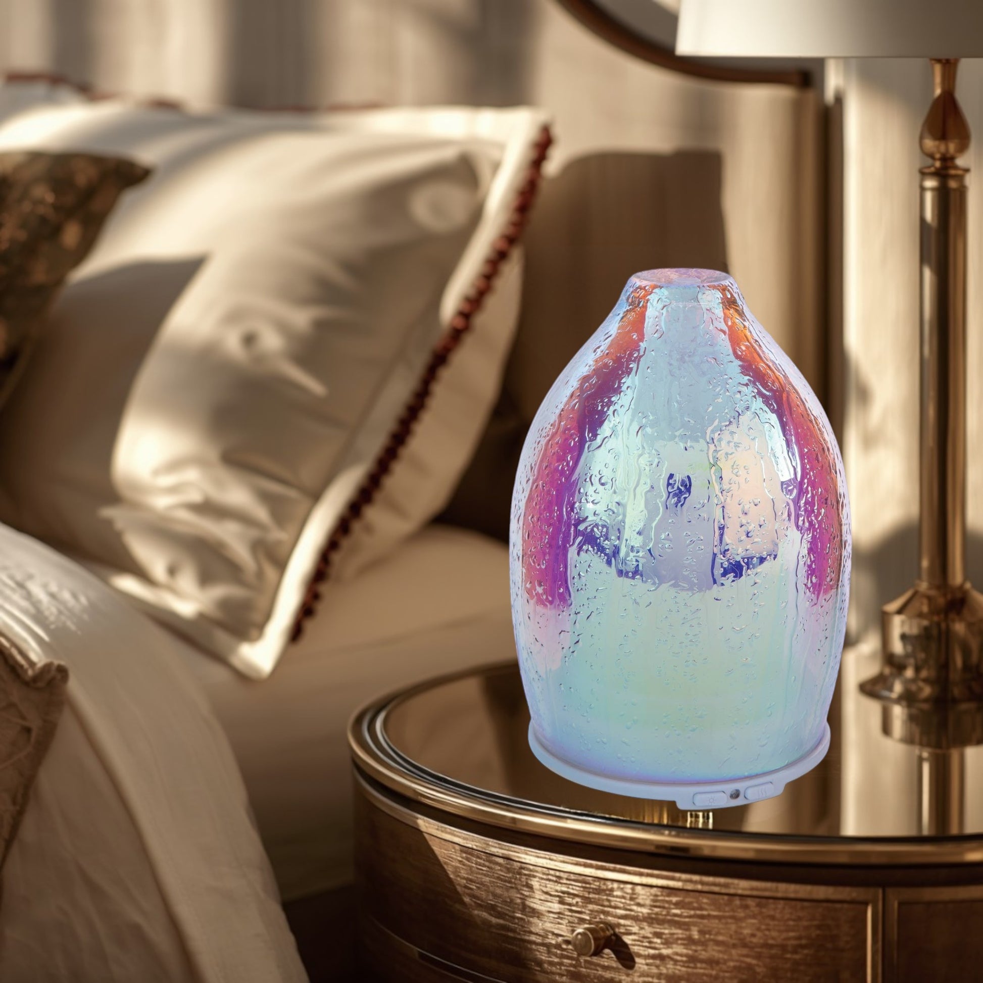 Doodlations Coffee Bar & Boutique iridescent water droplet aroma diffuser with textured glass and colorful shimmering finish.