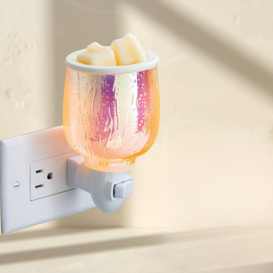 Doodlations Coffee Bar & Boutique iridescent plug-in wax warmer with a textured glass finish, melting wax cubes.