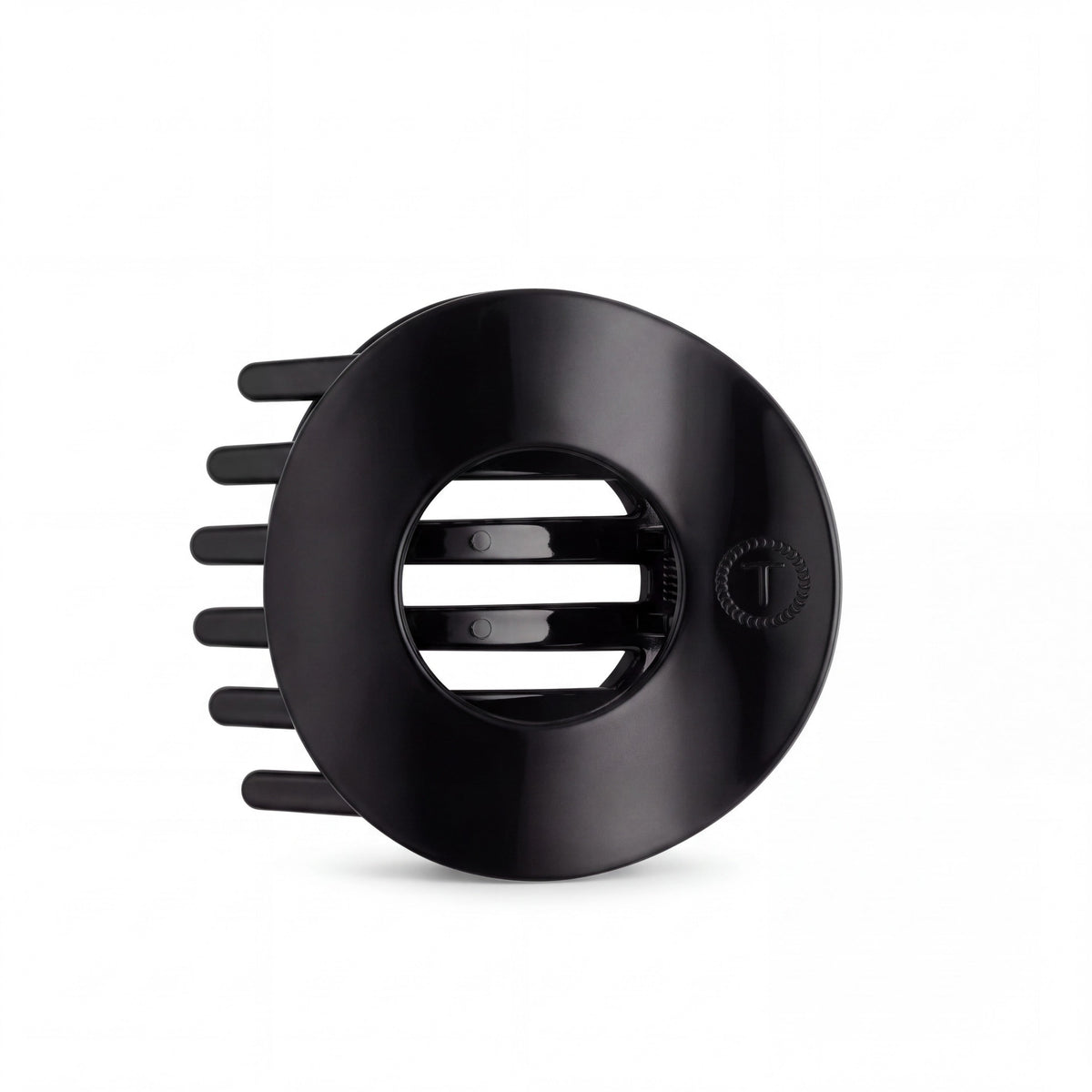 Doodlations Coffee Bar & Boutique Teleties jet black circular hair clip with a flat design and bendable teeth.