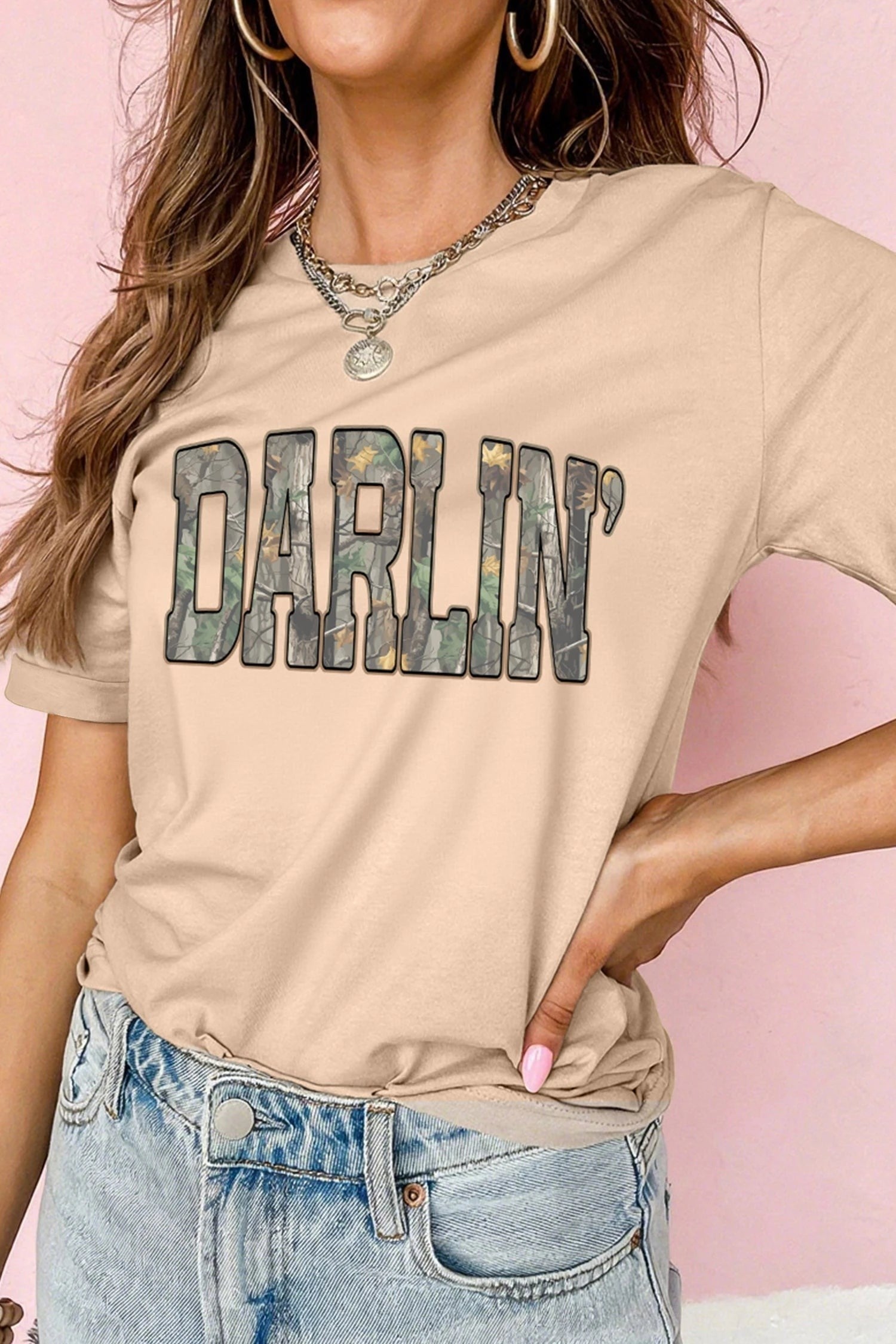 Doodlations Coffee Bar & Boutique khaki crewneck t-shirt featuring a DARLIN camo print graphic on the chest.
