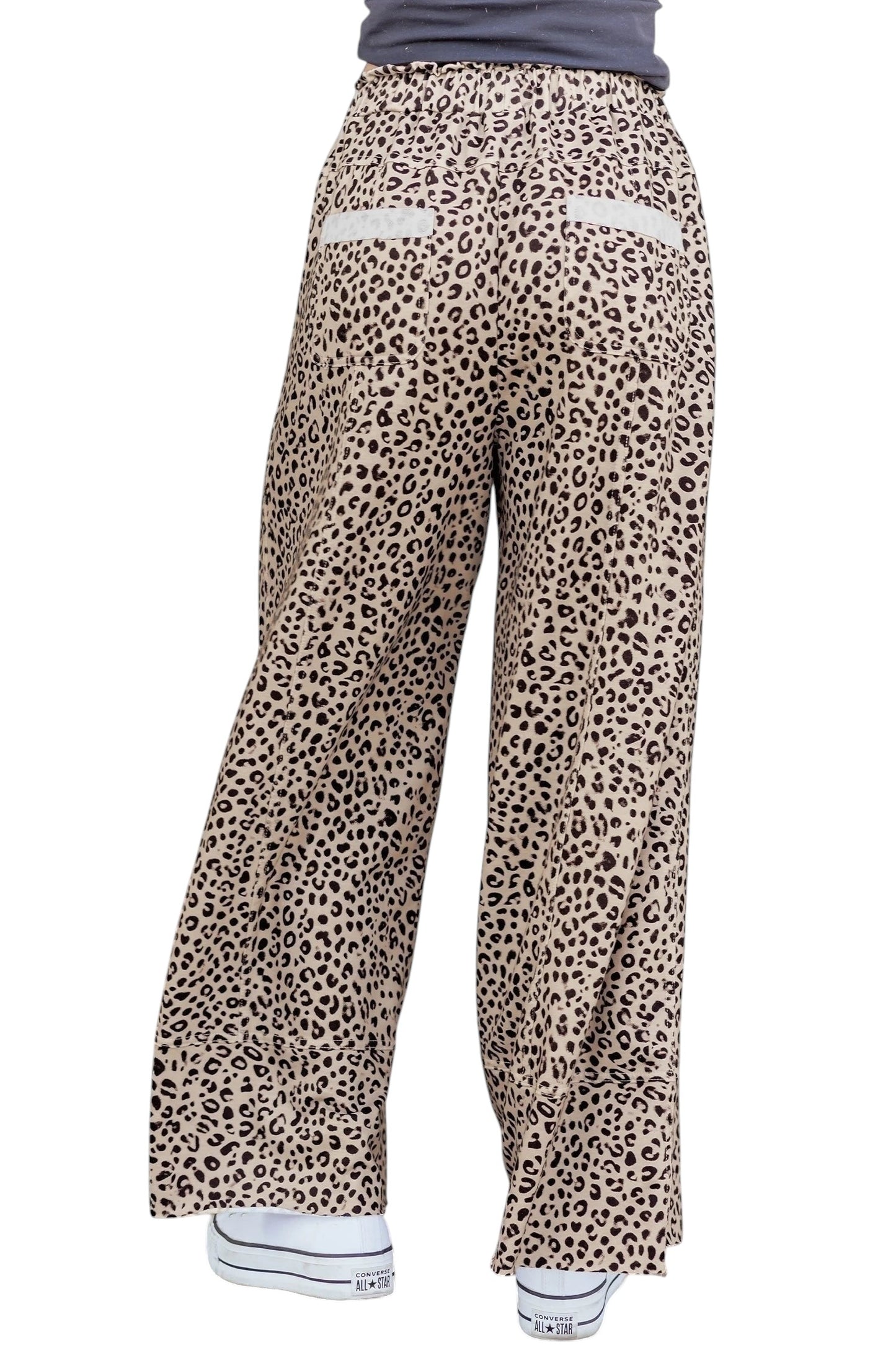 Doodlations Coffee Bar & Boutique khaki leopard print wide leg pants with a relaxed fit and back pockets.