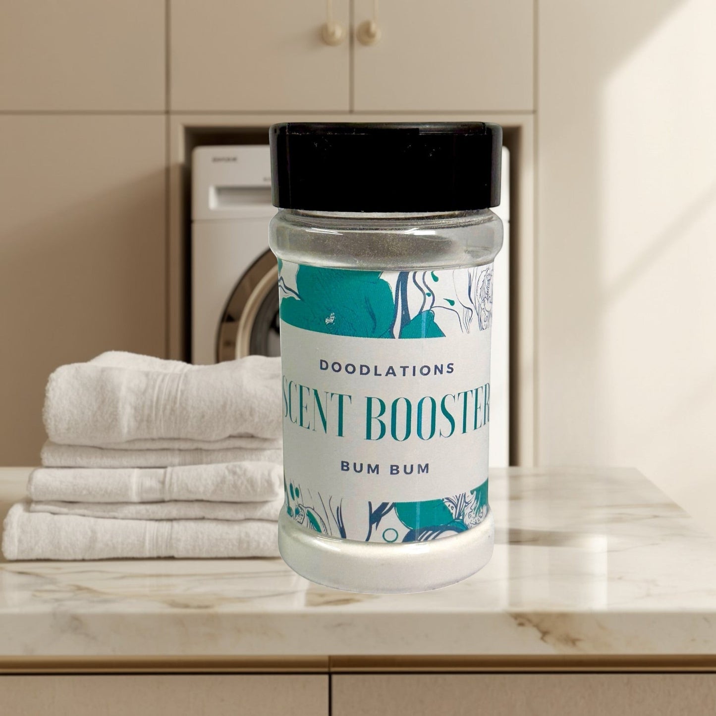 Doodlations Coffee Bar & Boutique Bum Bum laundry scent booster in a clear jar with a black lid. Tropical scent.