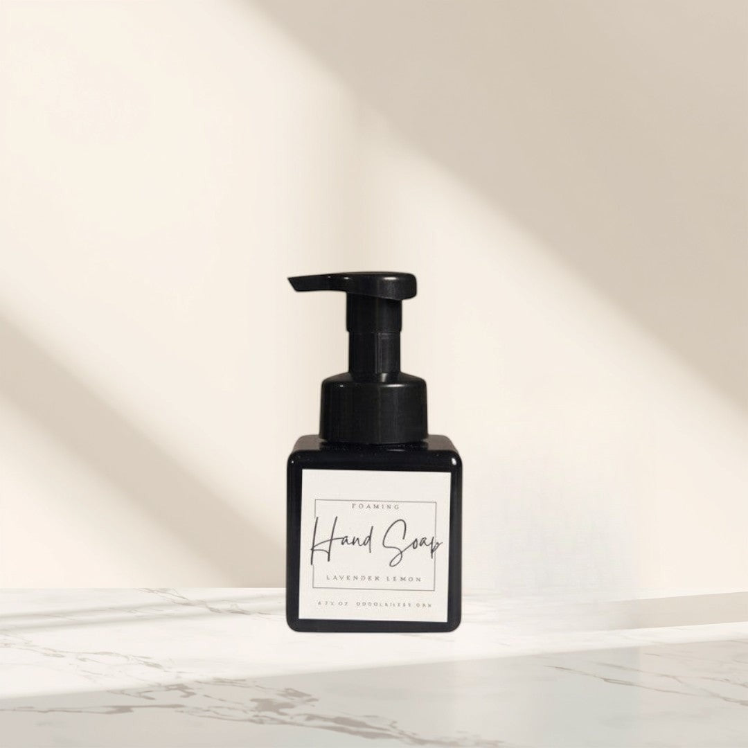Doodlations Coffee Bar & Boutique Lavender & Lemon foaming hand soap in a black square bottle with a black pump.