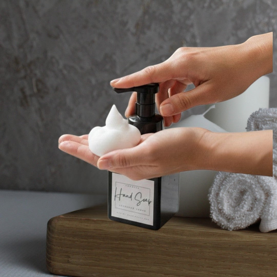 Doodlations Coffee Bar & Boutique Lavender & Lemon Foaming Hand Soap being dispensed into a hand.