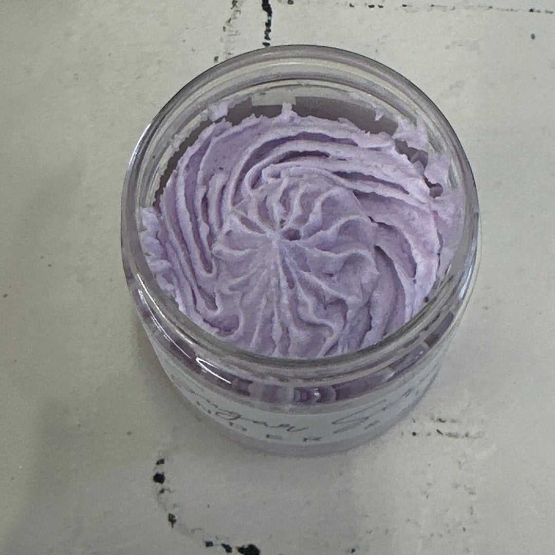 Doodlations Coffee Bar & Boutique Lavender & Lemon Sugar Scrub in a clear jar, swirled purple texture.