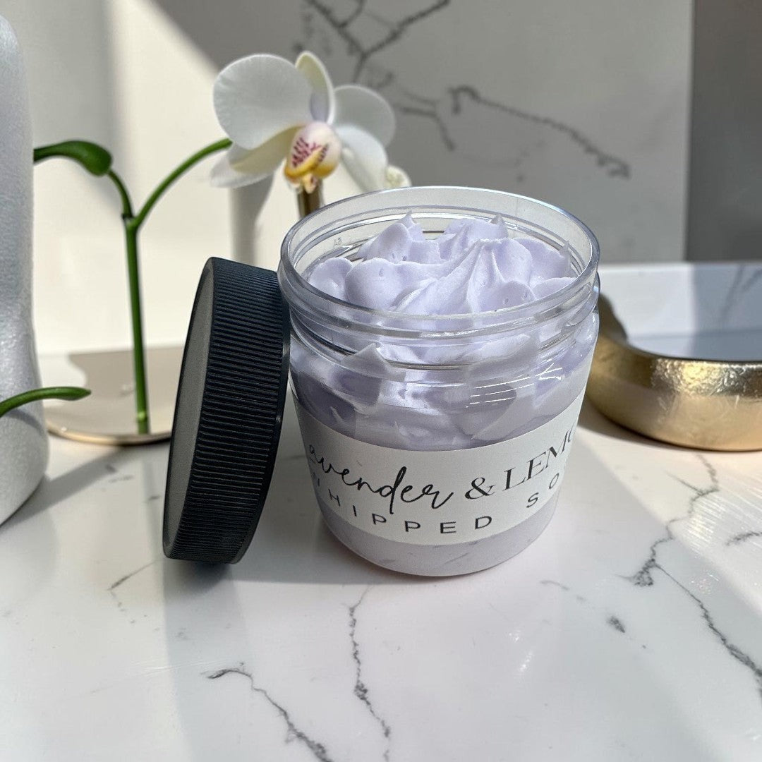 Doodlations Coffee Bar & Boutique lavender and lemon whipped body soap in a 4oz clear jar with a black lid.