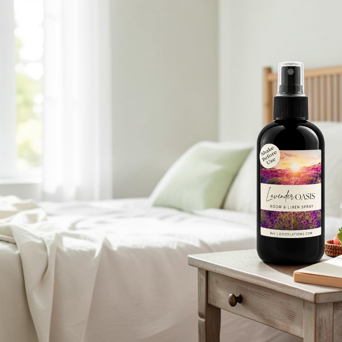 Doodlations Coffee Bar & Boutique Lavender Oasis room and linen spray in a black bottle on a bedside table.