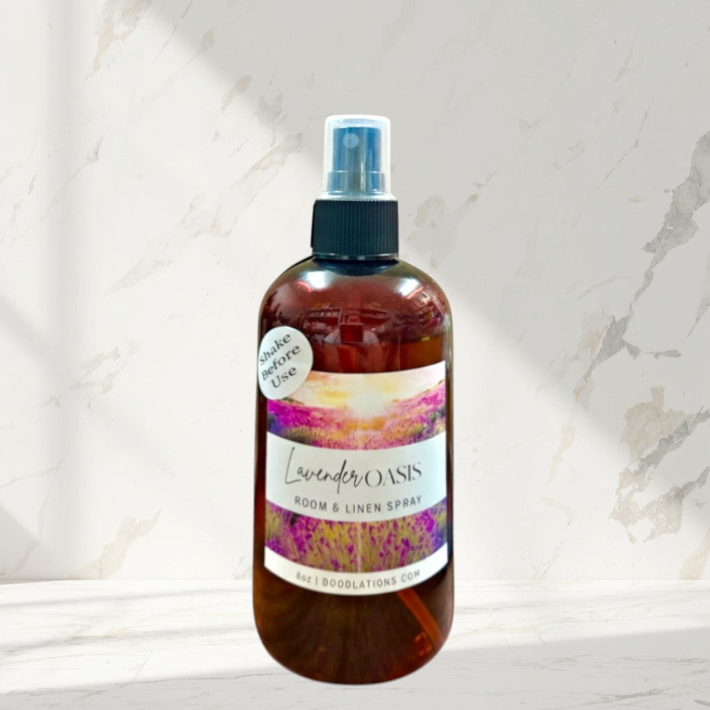 Doodlations Coffee Bar & Boutique Lavender Oasis Room & Linen Spray in a brown bottle with a scenic label.