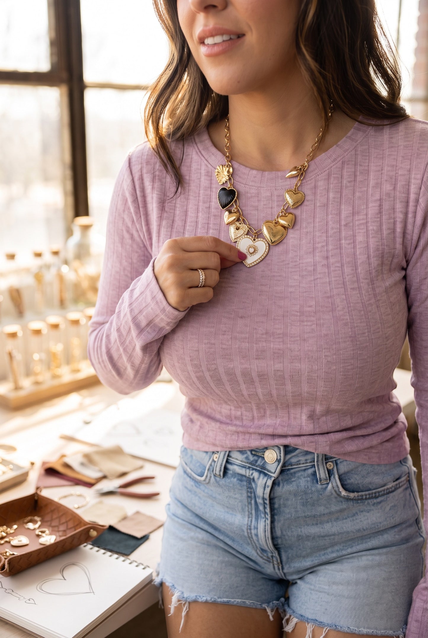 Doodlations Coffee Bar & Boutique lavender ribbed long sleeve top worn with a gold heart charm necklace