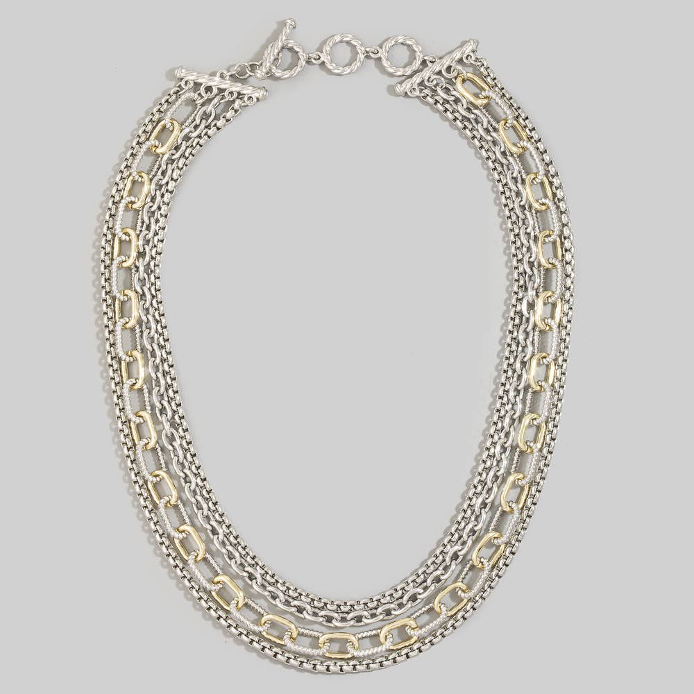 Doodlations Coffee Bar & Boutique layered multi-strand necklace with mixed silver and gold-tone chain links and toggle